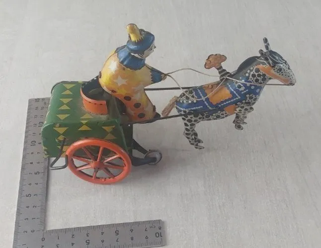 Ancien jouet mécanique en tôle, lithographie, cheval avec clown sur chariot