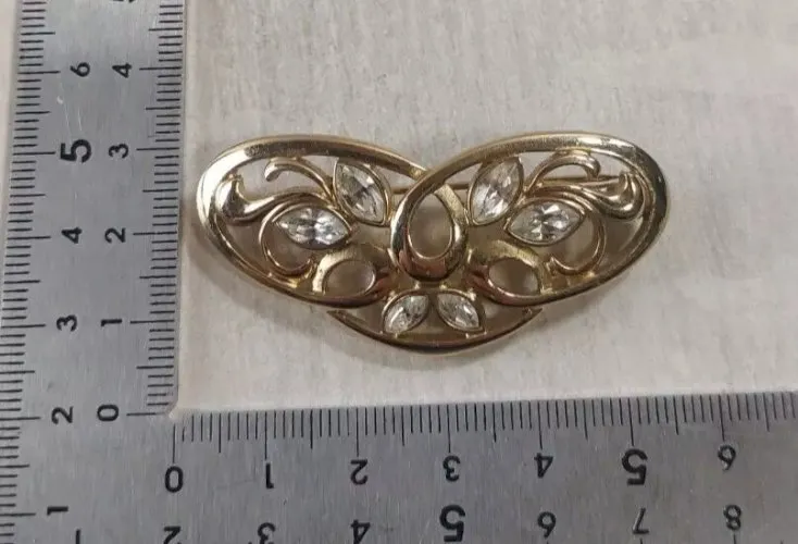 Ancienne broche en métal doré, Pierre Lang