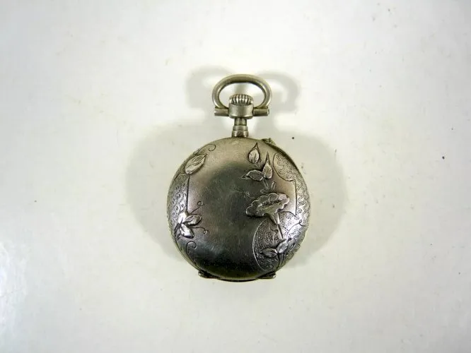 Ancienne montre gousset argent massif gravé Art Nouveau trompettes poinçons