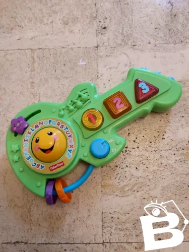 Guitare rire et eveil fisher price en bon etat