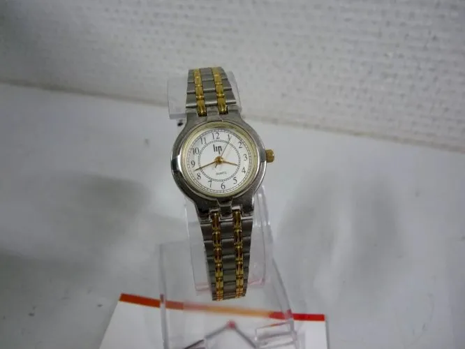 MONTRE LIP doré argenté femme 06-10 pile neuve