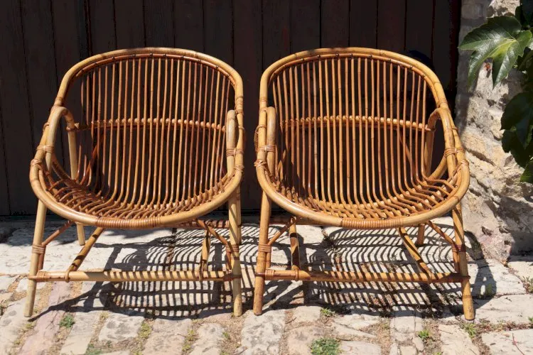 Paire de fauteuils en rotin par Audoux Minet 1950