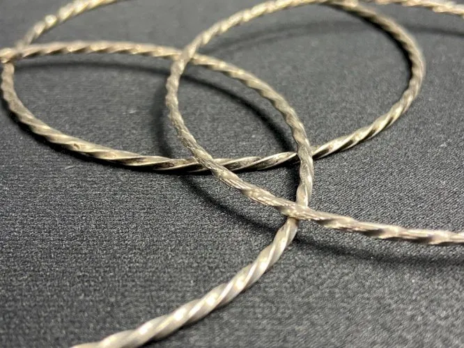 Suite de 3 bracelets en argent à décor torsadé