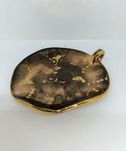 Vide poche -coupelle en ceramique style leon pointu en bon etat (made in chiner)